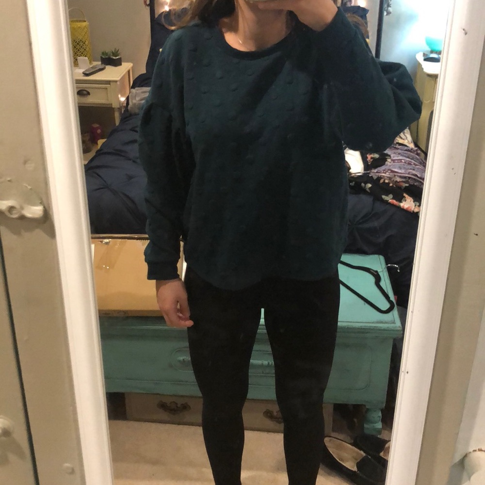Dark green sweater with polka dots